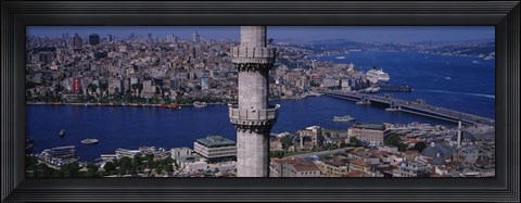 Framed Mid section view of a minaret with bridge across the bosphorus in the background, Istanbul, Turkey Print