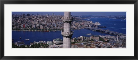 Framed Mid section view of a minaret with bridge across the bosphorus in the background, Istanbul, Turkey Print