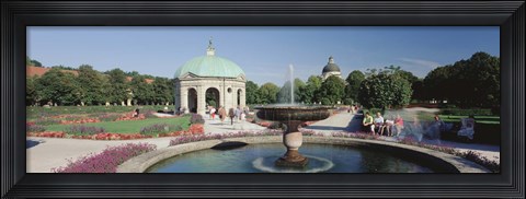 Framed Germany, Munich, Hofgarten, Tourist sitting in the park Print