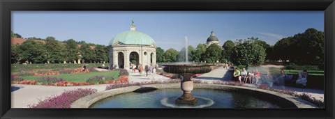 Framed Germany, Munich, Hofgarten, Tourist sitting in the park Print