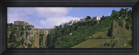 Framed Low angle view of a town, Tajo Bridge, Rio Guadalevin Gorge, Serrania De Ronda, Ronda, Andalusia, Spain Print