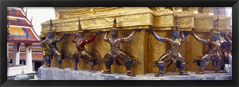 Framed Statues at base of golden chedi, The Grand Palace, Bangkok, Thailand Print