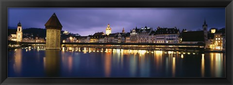 Framed Buildings lit up at dusk, Chapel Bridge, Reuss River, Lucerne, Switzerland Print