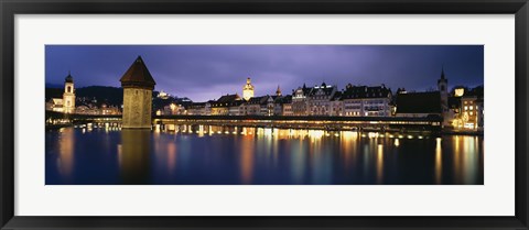 Framed Buildings lit up at dusk, Chapel Bridge, Reuss River, Lucerne, Switzerland Print