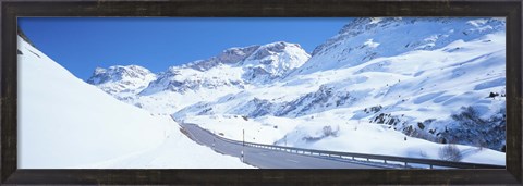 Framed Snow covered mountains on both sides of a road, St Moritz, Graubunden, Switzerland Print