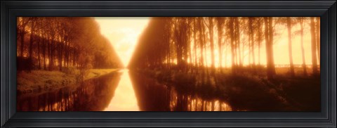 Framed Belgium, tree lined waterway through countryside, sepia tone Print