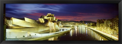 Framed Buildings lit up at dusk, Guggenheim Museum Bilbao, Bilbao, Vizcaya, Spain Print