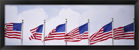 Framed Low angle view of American flags fluttering in wind Print