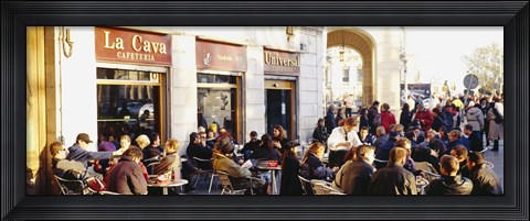 Framed Tourists sitting outside of a cafe, Barcelona, Spain Print