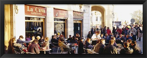 Framed Tourists sitting outside of a cafe, Barcelona, Spain Print