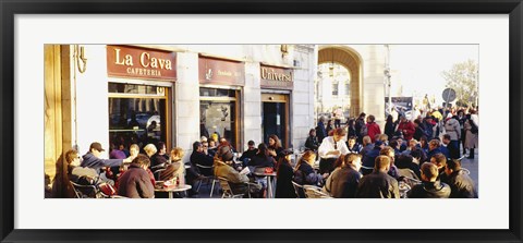 Framed Tourists sitting outside of a cafe, Barcelona, Spain Print