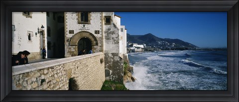Framed Tourists in a church beside the sea, Sitges, Spain Print