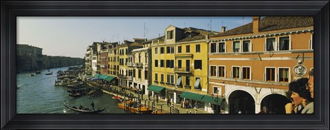 Framed Tourists looking at gondolas in a canal, Venice, Italy Print