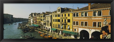 Framed Tourists looking at gondolas in a canal, Venice, Italy Print