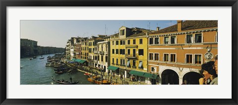 Framed Tourists looking at gondolas in a canal, Venice, Italy Print