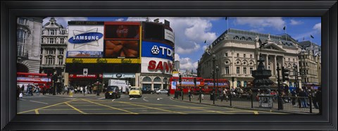 Framed Commercial signs on buildings, Piccadilly Circus, London, England Print
