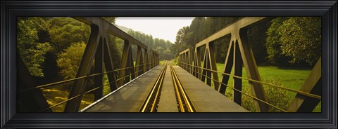 Framed Railroad tracks passing through a bridge, Germany Print