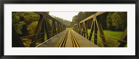 Framed Railroad tracks passing through a bridge, Germany Print