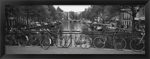 Framed Bicycle Leaning Against A Metal Railing On A Bridge, Amsterdam, Netherlands Print