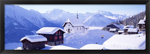 Framed Snow Covered Chapel and Chalets Swiss Alps Switzerland Print