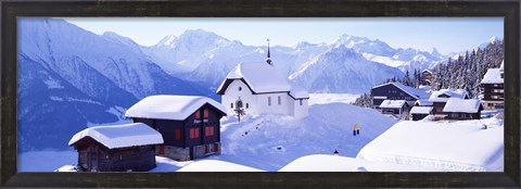 Framed Snow Covered Chapel and Chalets Swiss Alps Switzerland Print