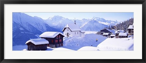 Framed Snow Covered Chapel and Chalets Swiss Alps Switzerland Print