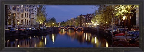 Framed Night View Along Canal Amsterdam The Netherlands Print