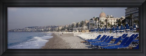 Framed Empty lounge chairs on the beach, Nice, French Riviera, France Print
