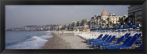 Framed Empty lounge chairs on the beach, Nice, French Riviera, France Print