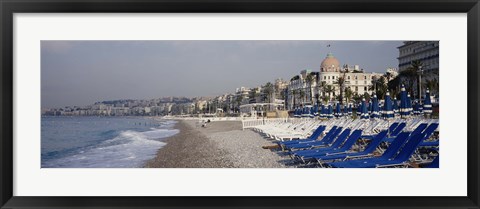 Framed Empty lounge chairs on the beach, Nice, French Riviera, France Print