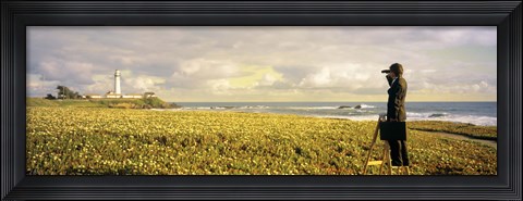 Framed USA, California, Businessman standing holding binoculars and looking at the lighthouse Print