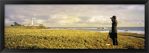 Framed USA, California, Businessman standing holding binoculars and looking at the lighthouse Print