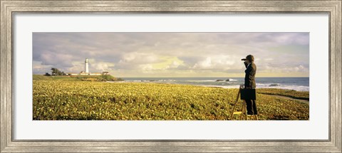 Framed USA, California, Businessman standing holding binoculars and looking at the lighthouse Print