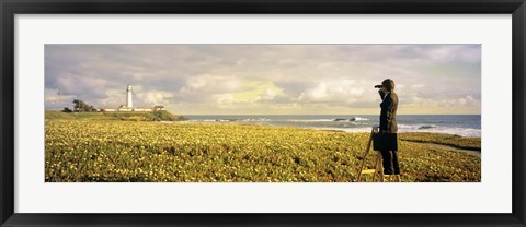 Framed USA, California, Businessman standing holding binoculars and looking at the lighthouse Print