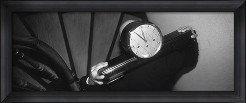 Framed Man Carrying Clock Up Stairs On Shoulders Print