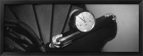 Framed Man Carrying Clock Up Stairs On Shoulders Print