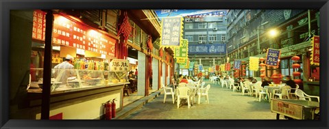 Framed Group of people sitting outside a restaurant, Beijing, China Print