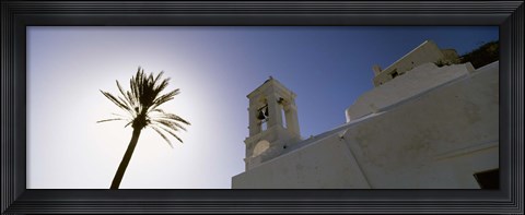 Framed Low angle view of a palm tree near a church , Ios, Cyclades Islands, Greece Print
