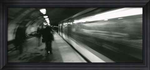 Framed Subway train passing through a subway station, London, England Print