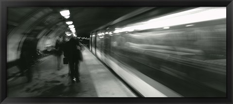 Framed Subway train passing through a subway station, London, England Print