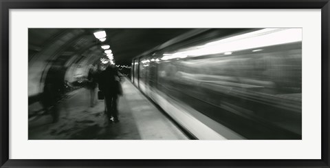 Framed Subway train passing through a subway station, London, England Print