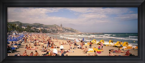 Framed Tourists on the beach, Sitges, Spain Print