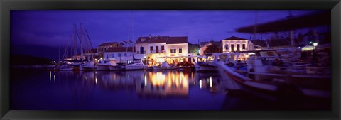 Framed Greece, Cephalonia, Light illuminated on harbor and outdoors cafe Print