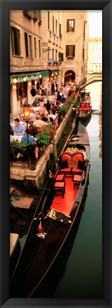 Framed Gondolas moored outside of a cafe, Venice, Italy Print