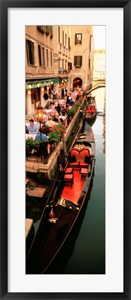 Framed Gondolas moored outside of a cafe, Venice, Italy Print