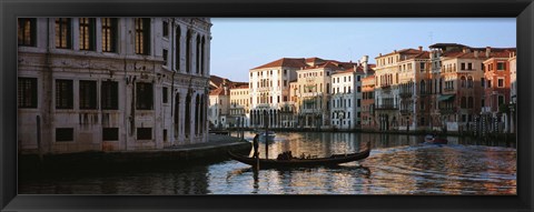 Framed Man on a gondola in a canal, Grand Canal, Venice, Italy Print