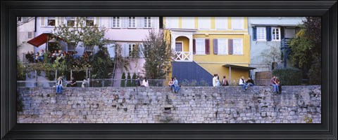 Framed Low Angle View Of A Group Of People Sitting On A Wall, Tubingen, Baden-Wurttemberg, Germany Print