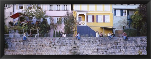 Framed Low Angle View Of A Group Of People Sitting On A Wall, Tubingen, Baden-Wurttemberg, Germany Print