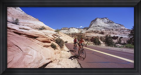 Framed Two people cycling on the road, Zion National Park, Utah, USA Print