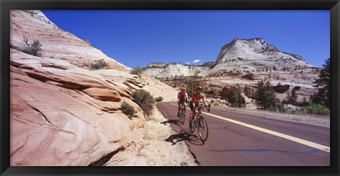 Framed Two people cycling on the road, Zion National Park, Utah, USA Print